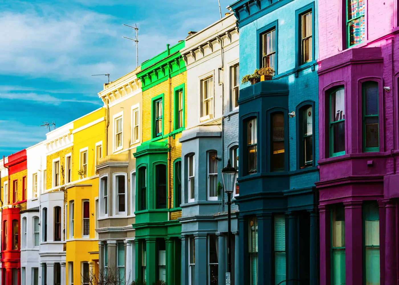Colourful terraced houses representing privately rented homes